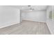 Bright living room with ceiling fan and light gray wood flooring at 3929 Torsby Pl # 3929, Las Vegas, NV 89119