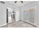 Bright living space features hardwood floors and an open view into a kitchen with stainless steel appliances at 3929 Torsby Pl # 3929, Las Vegas, NV 89119