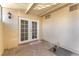 Cozy patio with white french doors leading to the home's interior at 3929 Torsby Pl # 3929, Las Vegas, NV 89119