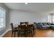 Dining room with table set, neutral walls, and open access to the living room at 4121 Satinwood Dr, Las Vegas, NV 89147