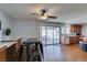 Dining area with dark wood floors, a table with stools, and access to the kitchen at 4121 Satinwood Dr, Las Vegas, NV 89147
