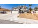Two story home with desert landscaping and large driveway at 4121 Satinwood Dr, Las Vegas, NV 89147