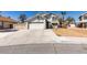 Two story home with desert landscaping and large driveway at 4121 Satinwood Dr, Las Vegas, NV 89147
