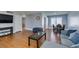 Inviting living room with wood floors, neutral walls, and views into the dining area at 4121 Satinwood Dr, Las Vegas, NV 89147