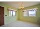 Cozy dining room featuring tile floors, window and a chandelier at 416 Wyoming St, Boulder City, NV 89005