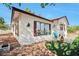 Charming single-story home with a well-maintained front yard, rock detail and cozy seating area at 416 Wyoming St, Boulder City, NV 89005