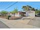 Charming single-story home with a well-maintained front yard, detached garage and extra yard space at 416 Wyoming St, Boulder City, NV 89005