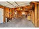 Spacious garage with exposed stud walls, storage shelves, and ample open space at 416 Wyoming St, Boulder City, NV 89005