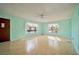 Bright living room featuring neutral paint, laminate flooring, two windows and ample natural light at 416 Wyoming St, Boulder City, NV 89005