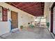 Covered patio with outdoor seating, lattice privacy screen, and security door at 416 Wyoming St, Boulder City, NV 89005