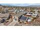 Aerial view of a two-story home with solar panels, a swimming pool and great neighborhood views at 429 Sunburst Dr, Henderson, NV 89002