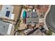 Aerial view of a well-maintained property featuring a sparkling pool, solar panels, and manicured landscaping at 429 Sunburst Dr, Henderson, NV 89002