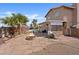 Backyard with pool, covered patio and a stone fire pit; perfect for outdoor relaxation and entertainment at 429 Sunburst Dr, Henderson, NV 89002