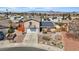 Charming two-story home with a spacious driveway and landscaped front yard with desert plants at 429 Sunburst Dr, Henderson, NV 89002