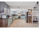 Well-equipped kitchen featuring stainless steel appliances, ample counter space, and tile floors at 429 Sunburst Dr, Henderson, NV 89002
