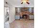 Cozy living room with fireplace and view into uniquely styled powder room at 429 Sunburst Dr, Henderson, NV 89002