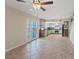 Open living space with kitchen view, glass panel french doors and access to stairway at 429 Sunburst Dr, Henderson, NV 89002