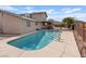 Inviting backyard pool with ladder access and spacious concrete deck, perfect for outdoor relaxation at 429 Sunburst Dr, Henderson, NV 89002