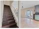 Elegant wooden staircase leading to an upper level, bathed in natural light at 429 Sunburst Dr, Henderson, NV 89002