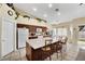 Spacious kitchen with a large island, white appliances, and ample cabinet space, perfect for cooking and entertaining at 4322 Summers Shade St, Las Vegas, NV 89147