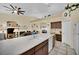 Spacious kitchen featuring a large island with a sink, ample counter space, and seamless flow into the living areas at 4322 Summers Shade St, Las Vegas, NV 89147