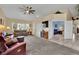 Bright and airy living room featuring neutral carpet, and ample natural light at 4322 Summers Shade St, Las Vegas, NV 89147