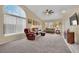 Bright and airy living room featuring neutral carpet, and ample natural light at 4322 Summers Shade St, Las Vegas, NV 89147