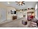 Bright and airy living room featuring neutral carpet, and ample natural light at 4322 Summers Shade St, Las Vegas, NV 89147