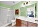 Clean bathroom featuring a glass-enclosed shower and wood-finish vanity with a single sink at 4555 E Sahara Ave # 120, Las Vegas, NV 89104