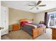 Bedroom with neutral walls, ceiling fan, and sliding glass door providing ample natural light at 4555 E Sahara Ave # 120, Las Vegas, NV 89104