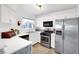 Bright kitchen featuring white cabinetry, stainless steel appliances, and neutral countertops at 4555 E Sahara Ave # 120, Las Vegas, NV 89104