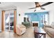 Comfortable living room with fireplace, sliding glass doors, ceiling fan and entertainment center at 4555 E Sahara Ave # 120, Las Vegas, NV 89104