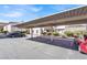 Parking area featuring covered parking spaces, with well-kept landscaping surrounding the complex at 4555 E Sahara Ave # 120, Las Vegas, NV 89104