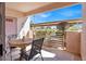 Covered patio featuring seating, a satellite dish, and a privacy fence for outdoor relaxation at 4555 E Sahara Ave # 120, Las Vegas, NV 89104