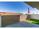 Paver patio with small lawn and block wall at 4790 Equinox Sky Ave # 2, North Las Vegas, NV 89084