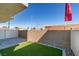 Private backyard with synthetic grass and stone perimeter, perfect for relaxing and low maintenance at 4790 Equinox Sky Ave # 2, North Las Vegas, NV 89084