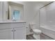 Bathroom features a vanity, toilet, and tiled shower at 4790 Equinox Sky Ave # 2, North Las Vegas, NV 89084