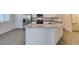 Spacious kitchen island with sink and modern finishes at 4790 Equinox Sky Ave # 2, North Las Vegas, NV 89084