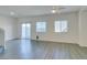 Spacious living room with wood floors, ceiling fan and natural light at 4790 Equinox Sky Ave # 2, North Las Vegas, NV 89084