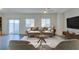 Bright and staged living room featuring a modern design and lots of sunlight at 4790 Equinox Sky Ave # 2, North Las Vegas, NV 89084