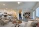 Bright, staged living room with modern finishes and an open floorplan at 4790 Equinox Sky Ave # 2, North Las Vegas, NV 89084