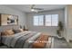 Staged bedroom with a plush bed and an abundance of natural light at 4790 Equinox Sky Ave # 2, North Las Vegas, NV 89084