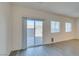 Sliding glass door to an outdoor patio space with paver stones, perfect for relaxation and entertaining at 4790 Equinox Sky Ave # 2, North Las Vegas, NV 89084