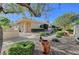 Serene backyard featuring a built-in barbecue, gravel landscaping, and lush greenery for outdoor enjoyment at 4936 Mountain Foliage Dr, Las Vegas, NV 89148