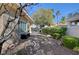 Home exterior backyard with stone pavers and mature trees at 4936 Mountain Foliage Dr, Las Vegas, NV 89148