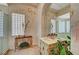 Elegant bathroom featuring a vanity, glass block window, and ornate detailing for a luxurious feel at 4936 Mountain Foliage Dr, Las Vegas, NV 89148