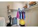 Walk-in closet with rods and shelves for ample storage space, plus some fitness equipment at 4936 Mountain Foliage Dr, Las Vegas, NV 89148