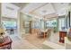 Elegant dining room with a chandelier, hardwood flooring, and a large table for entertaining guests at 4936 Mountain Foliage Dr, Las Vegas, NV 89148