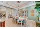 Dining room includes a decorative ceiling, chandelier, and seating for eight alongside a china cabinet at 4936 Mountain Foliage Dr, Las Vegas, NV 89148