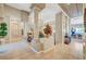 Grand foyer with tiled floor and large decorative columns that add to the elegance of the home at 4936 Mountain Foliage Dr, Las Vegas, NV 89148